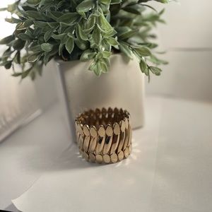 Gold tone stretch bracelet can fit large wrist